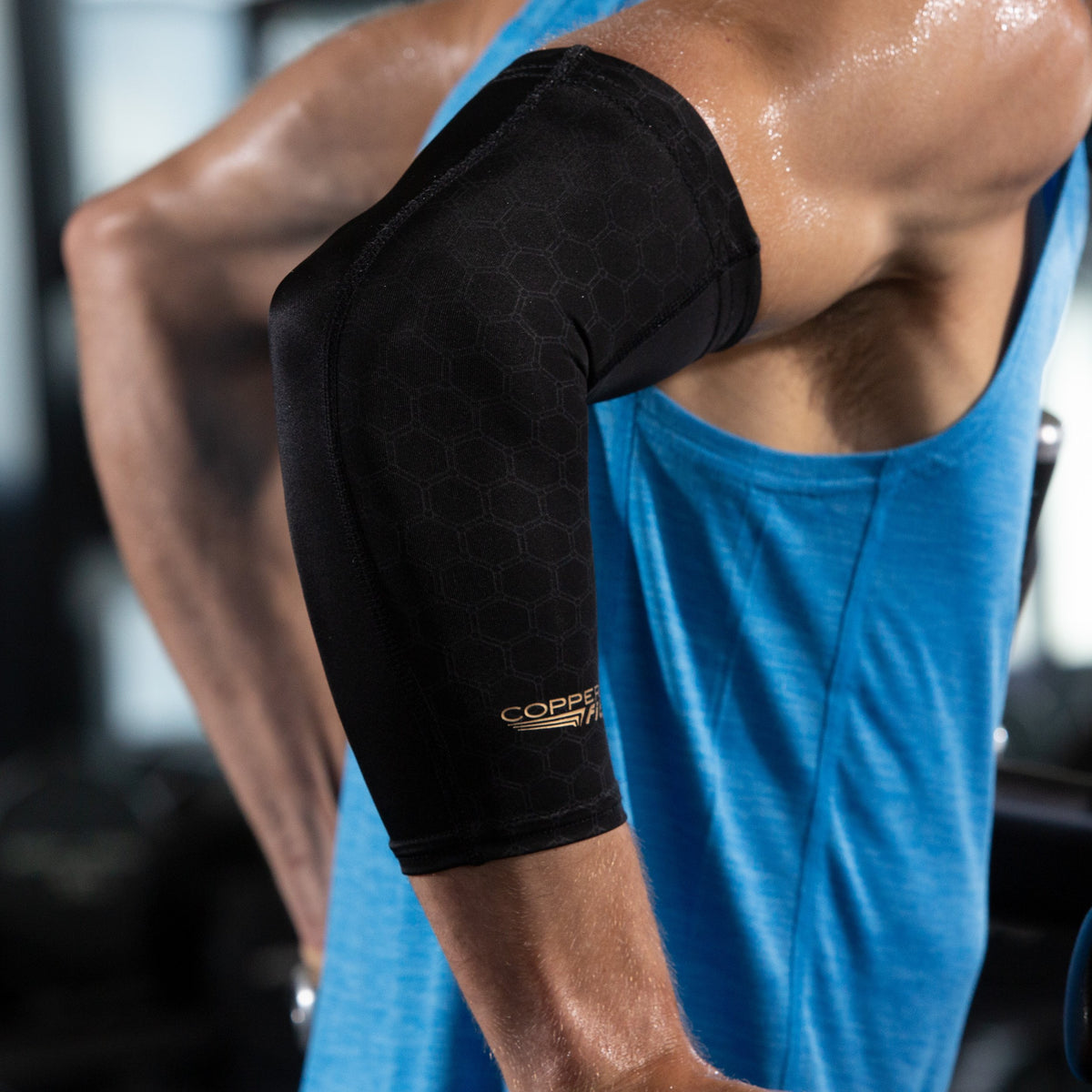 Compression sleeve around elbow for support and all-day comfort.