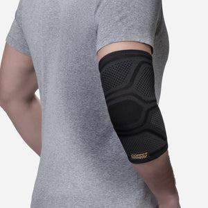 Compression sleeve around elbow for support and all-day comfort.