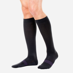 Graduated compression socks infused with shea butter, coconut oil, Vitamin E, and aloe vera for hydration