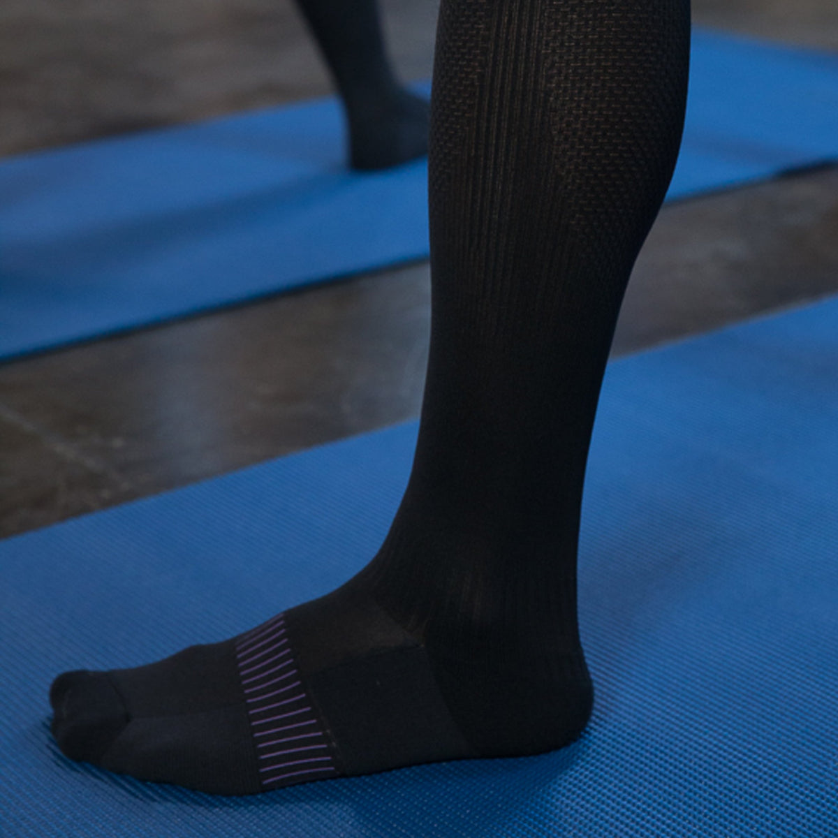 Graduated compression socks infused with shea butter, coconut oil, Vitamin E, and aloe vera for hydration