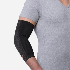 Compression sleeve around elbow for support and all-day comfort.