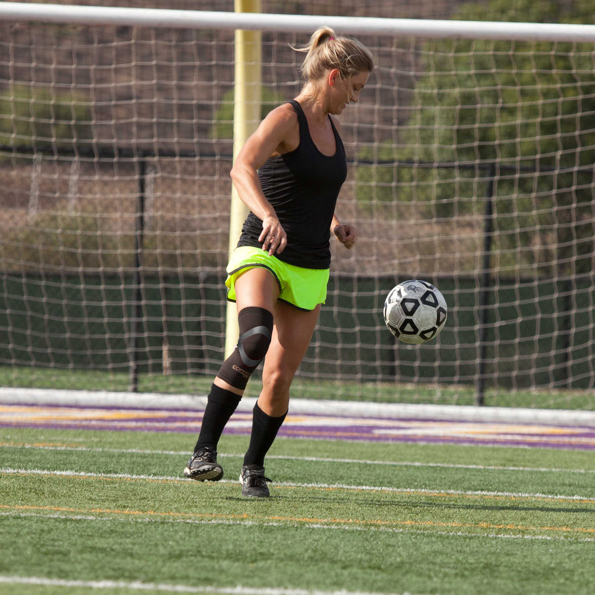 Compression sleeve around knee with built in kinesiology tape  for support and all-day comfort.