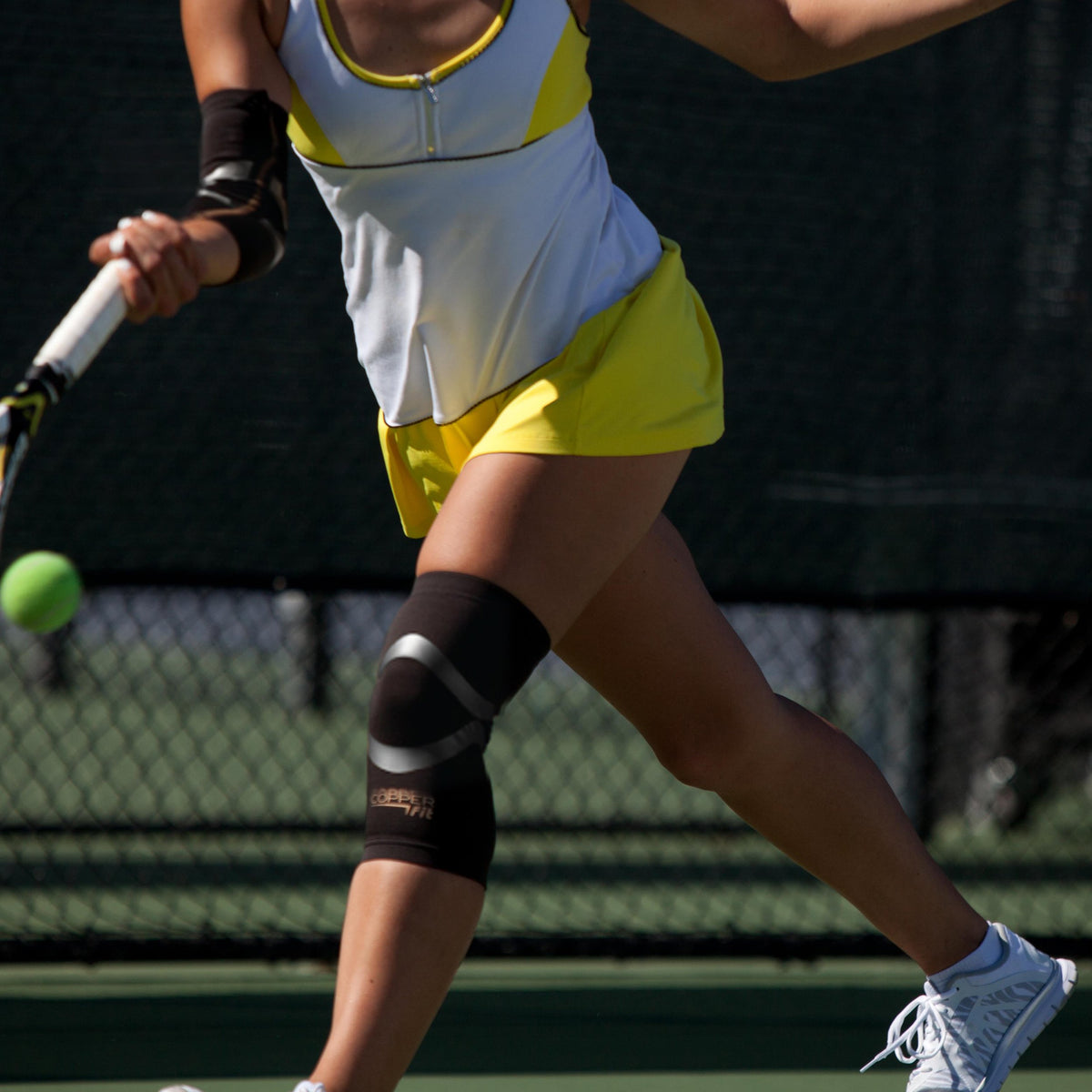Compression sleeve around knee with built in kinesiology tape  for support and all-day comfort.