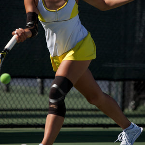 Compression sleeve around knee with built in kinesiology tape  for support and all-day comfort.