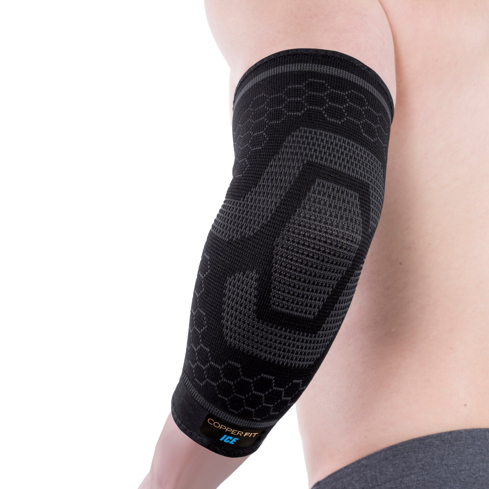 A person wearing a black ice compression elbow sleeve which has a patterned design and appears to provide support and compression. product