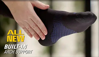 Extreme close up shot of the sock with the person's hand resting over their heel and arch